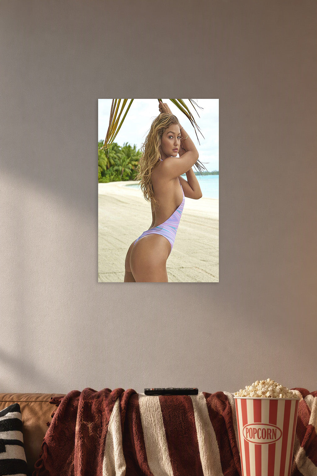 Gigi Hadid Beach Fashion in a cozy movie room above a brown sofa with popcorn.