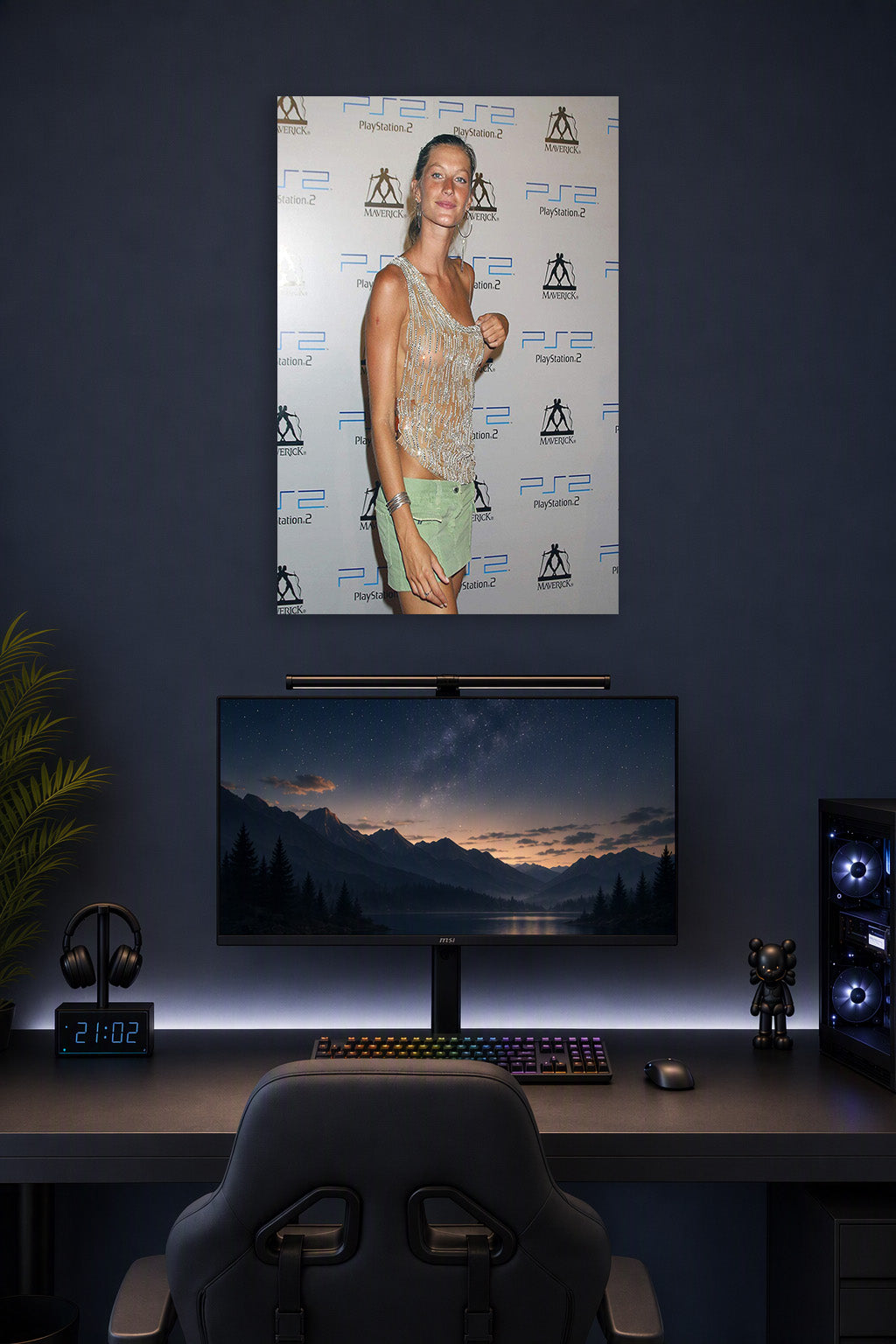 Gisele Bündchen in a gaming desk setup above a monitor.