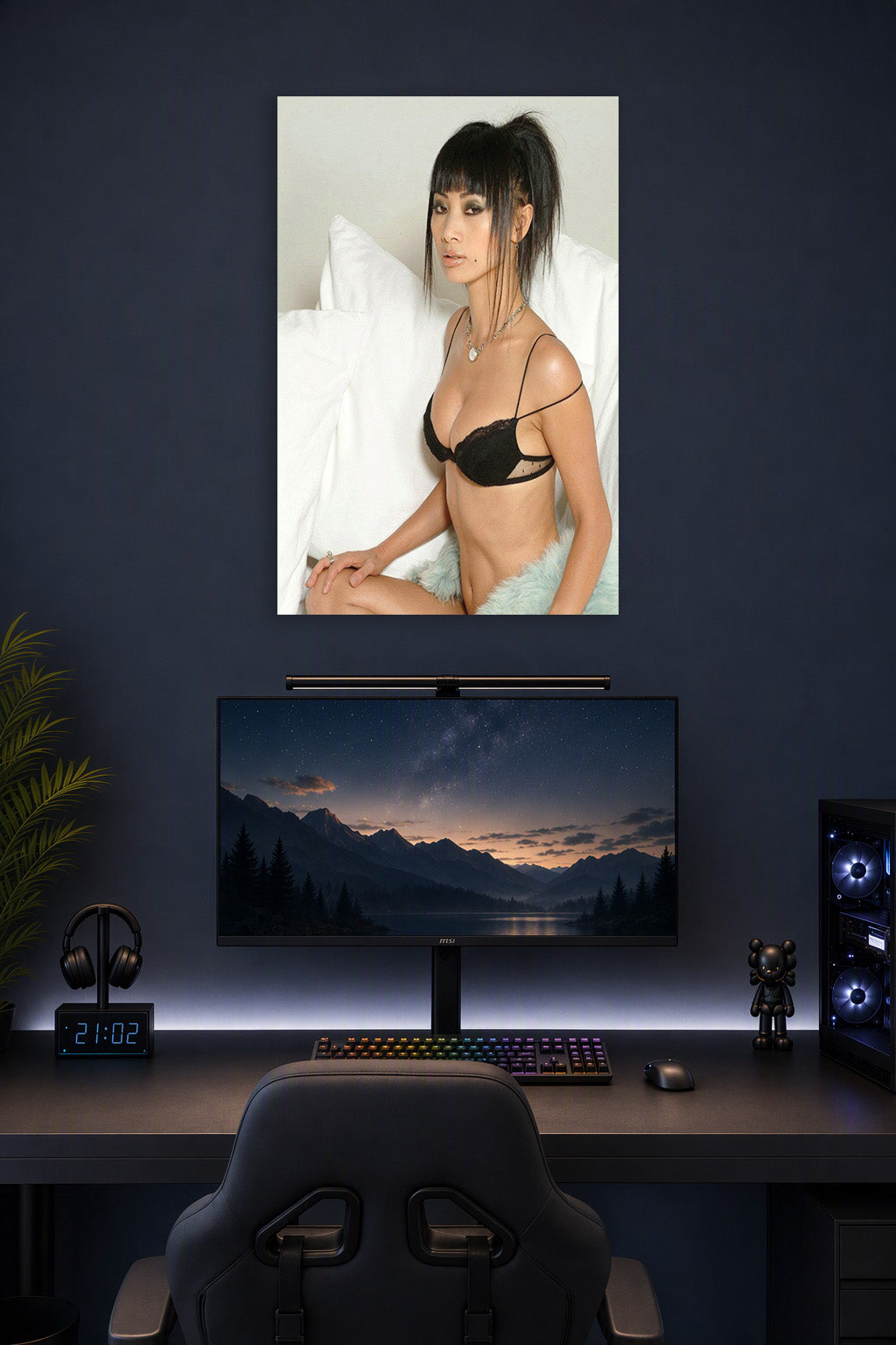 Glamorous Asian Woman in a gaming desk setup above a monitor.