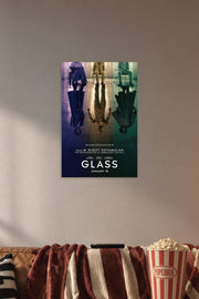 Glass Movie Poster in a cozy movie room above a brown sofa with popcorn.