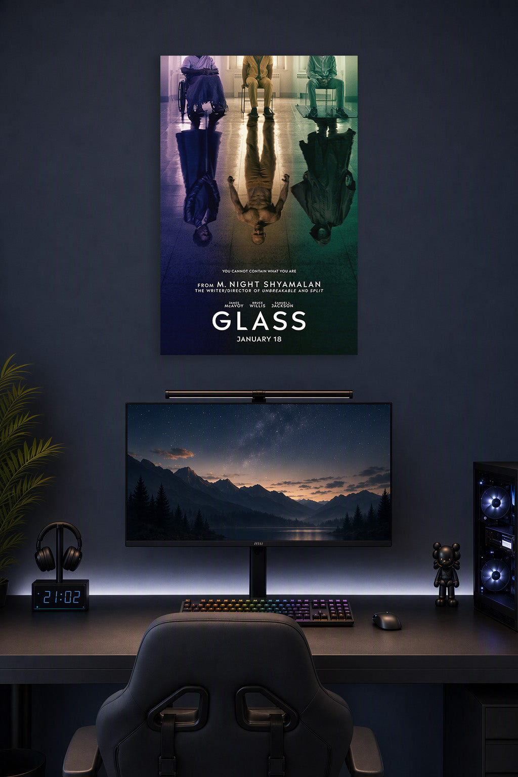 Glass Movie Poster in a gaming desk setup above a monitor.