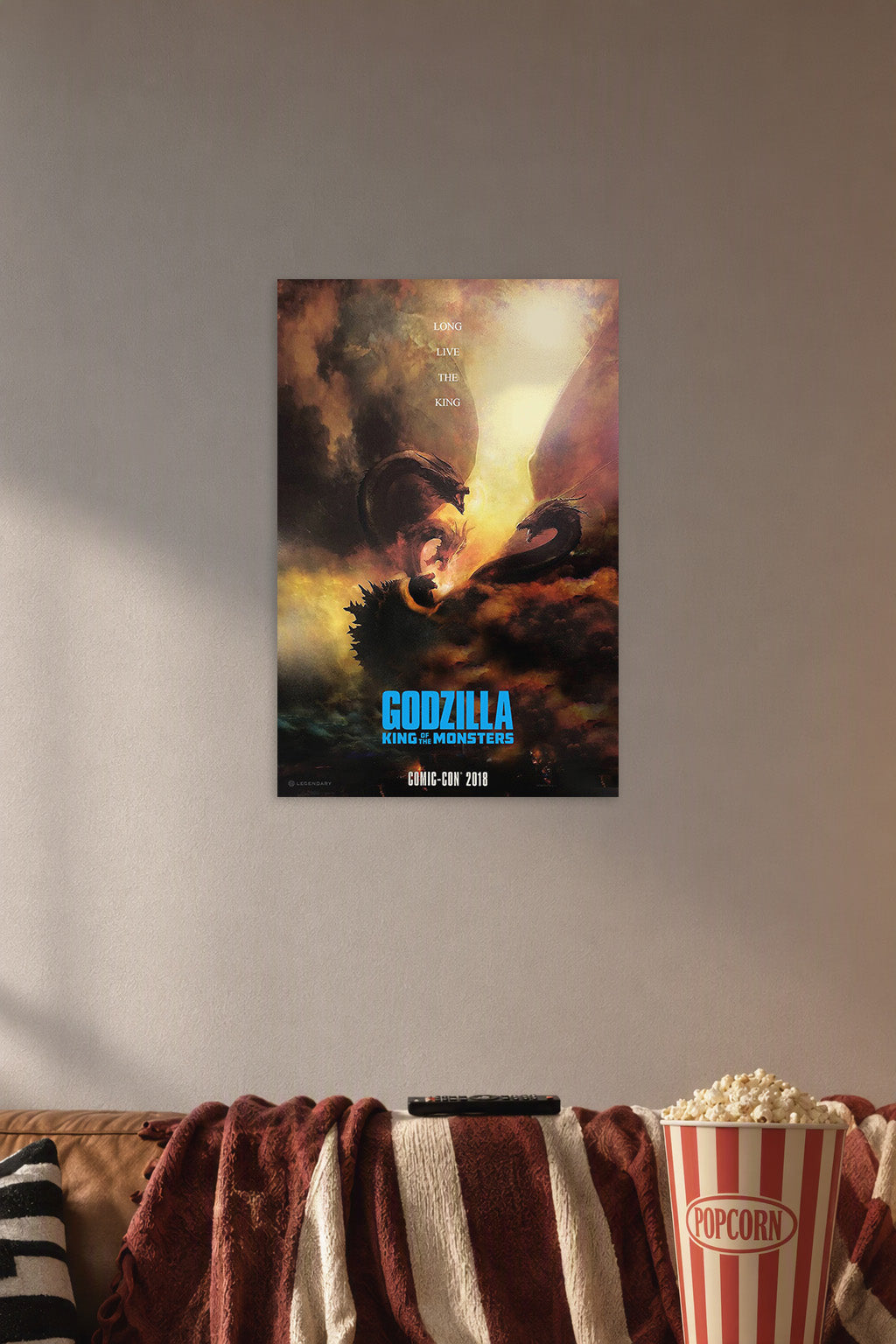 Godzilla King Ghidorah Battle in a cozy movie room above a brown sofa with popcorn.