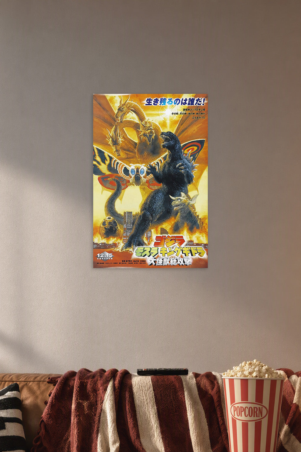 Godzilla King Ghidorah Mothra Movie Poster in a cozy movie room above a brown sofa with popcorn.