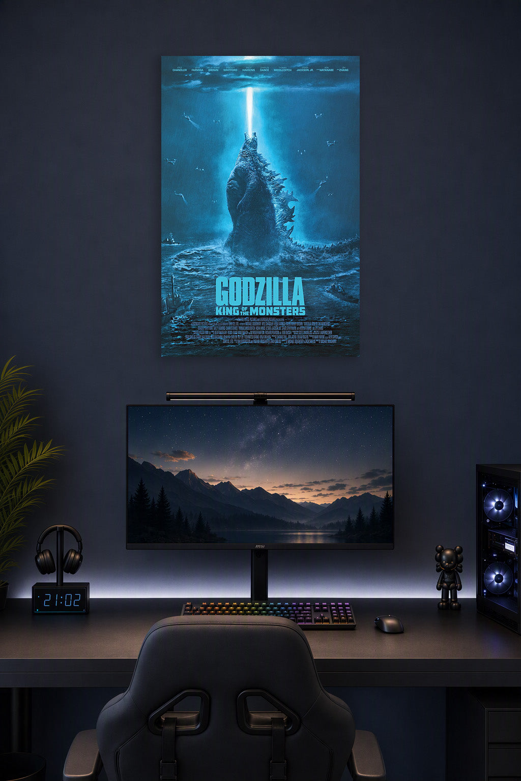 Godzilla King of the Monsters in a gaming desk setup above a monitor.