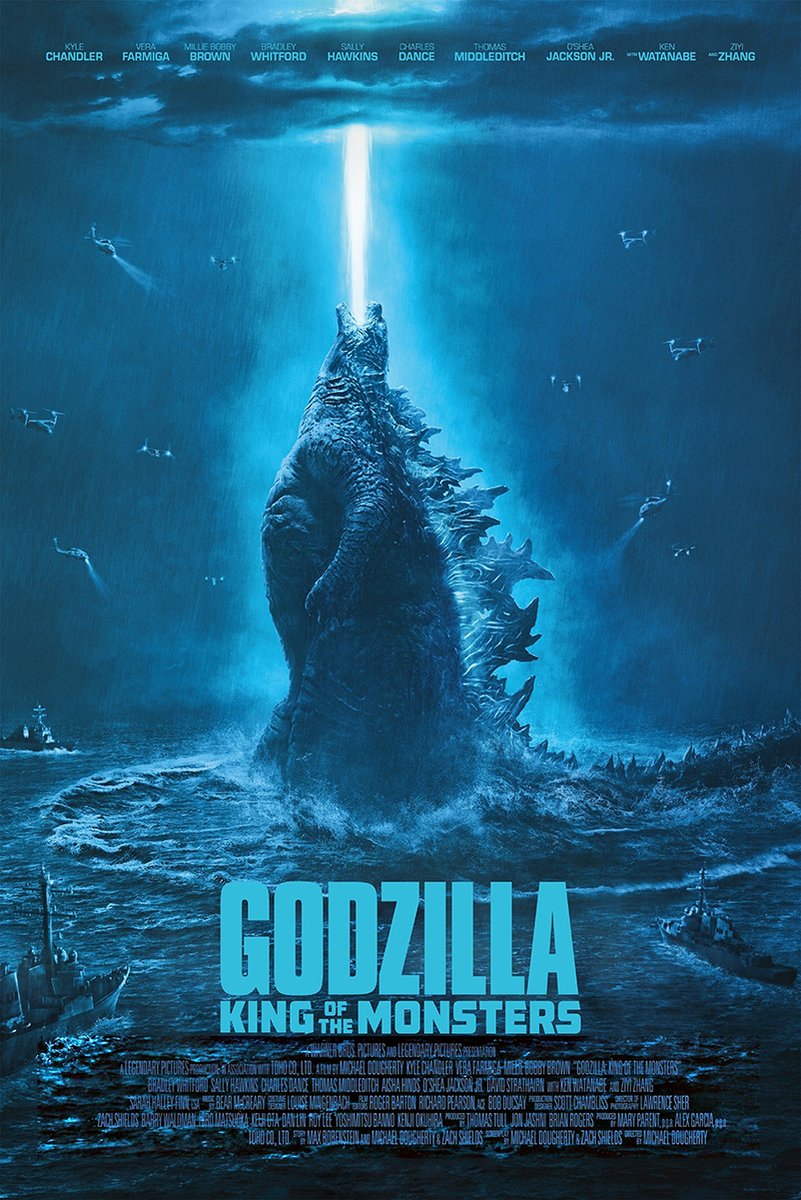 Godzilla King of the Monsters poster depicts Godzilla rising from a stormy blue ocean and firing a white beam skyward as aircraft circle.