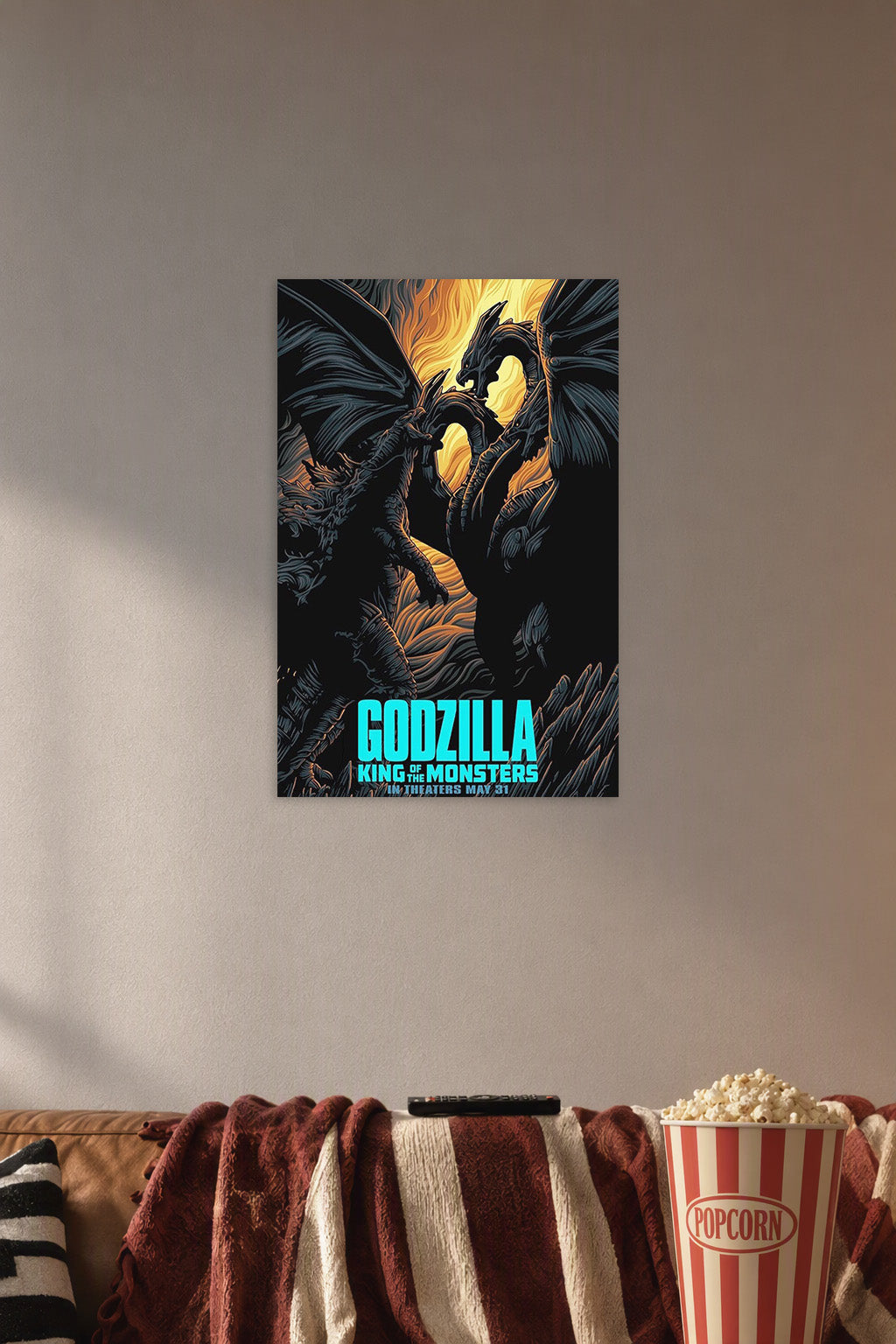 Godzilla King of the Monsters vs. King Ghidorah in a cozy movie room above a brown sofa with popcorn.