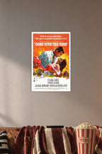 Gone With The Wind Movie Poster in a cozy movie room above a brown sofa with popcorn.