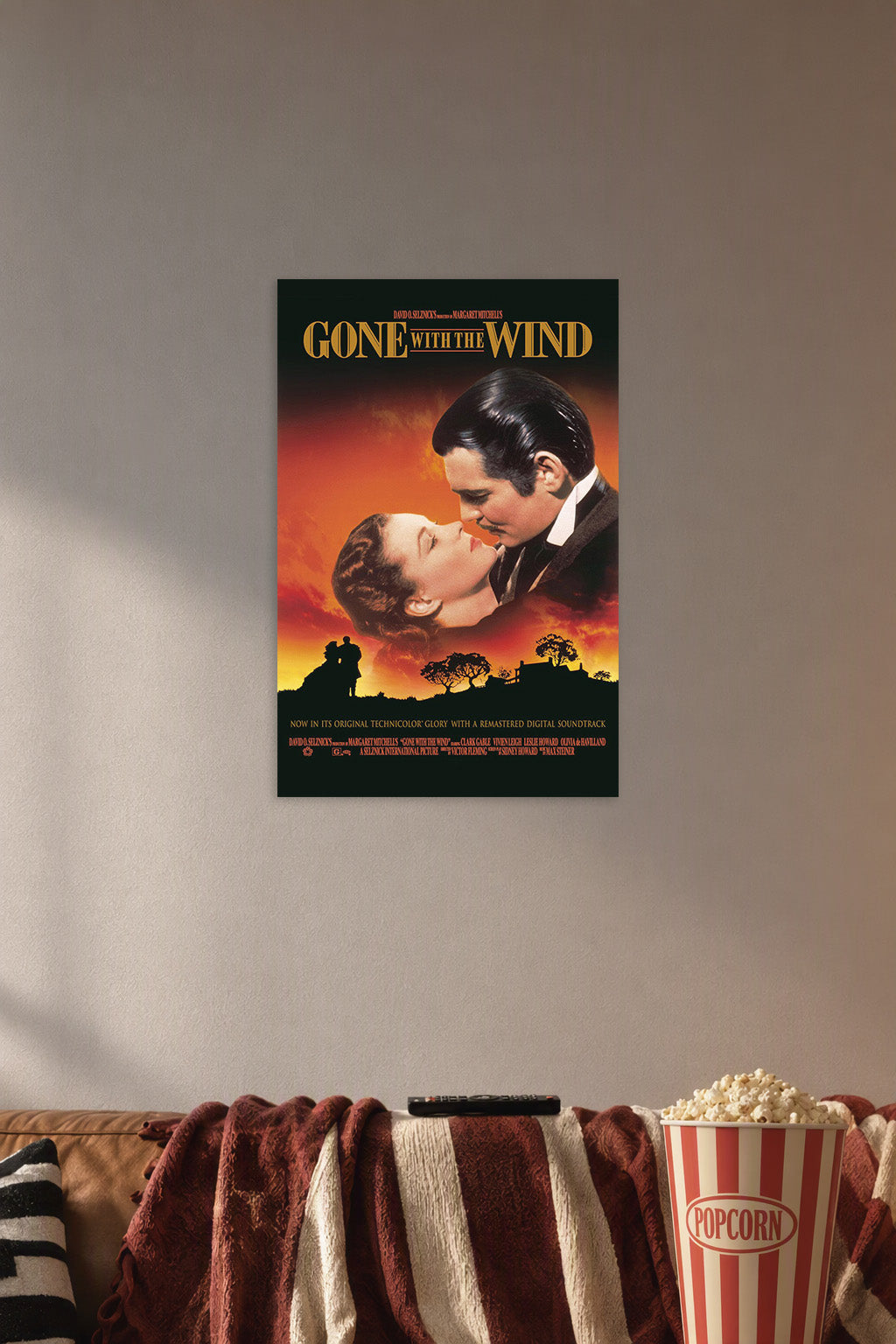 Gone With the Wind in a cozy movie room above a brown sofa with popcorn.