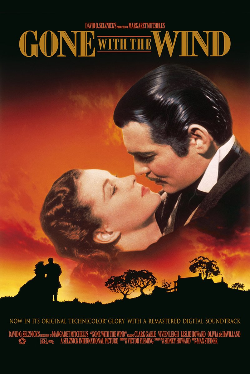 Gone with the Wind poster features a couple in a close embrace over a fiery orange sunset with silhouetted trees and estate.