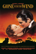 Gone with the Wind poster features a couple in a close embrace over a fiery orange sunset with silhouetted trees and estate.