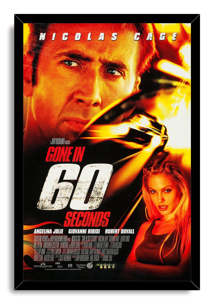 Gone in 60 Seconds framed wall art print presents Nicolas Cage, Angelina Jolie, a fast car, and dramatic orange, red, and black artwork.