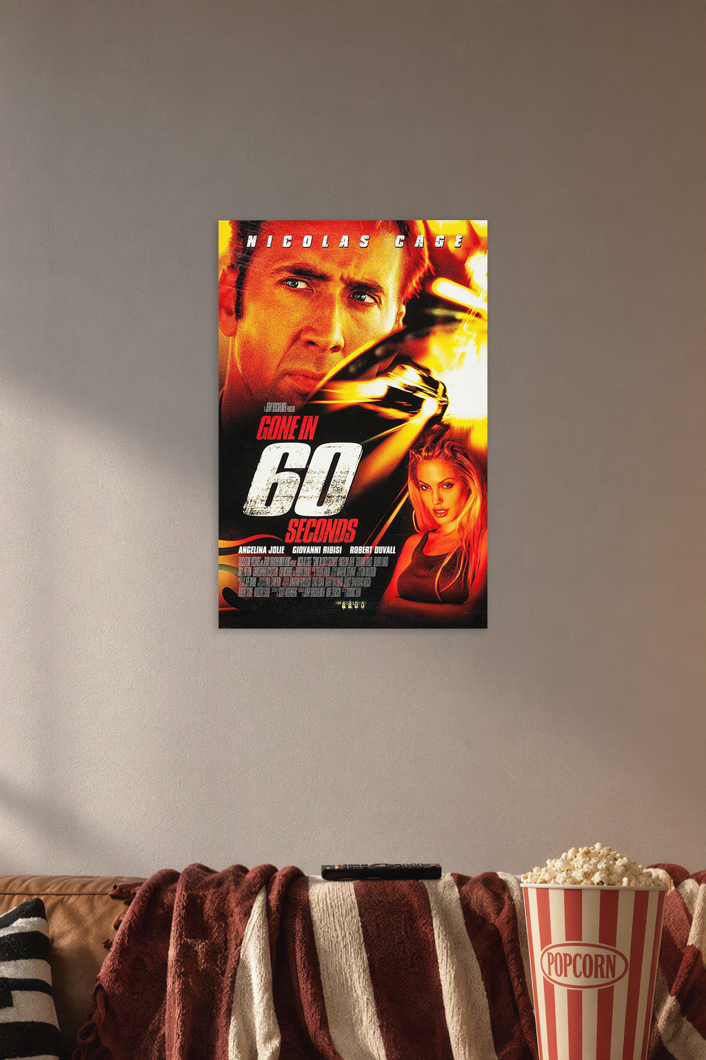 Gone in 60 Seconds Movie Poster in a cozy movie room above a brown sofa with popcorn.