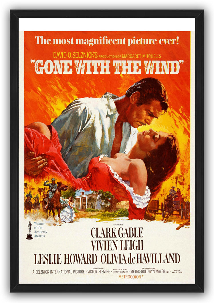 Gone with the Wind framed wall art print featuring the dramatic couple in an embrace, fiery orange background, riders, carriage, and mansion.