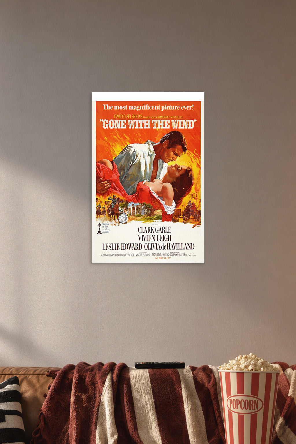 Gone with The Wind Movies in a cozy movie room above a brown sofa with popcorn.
