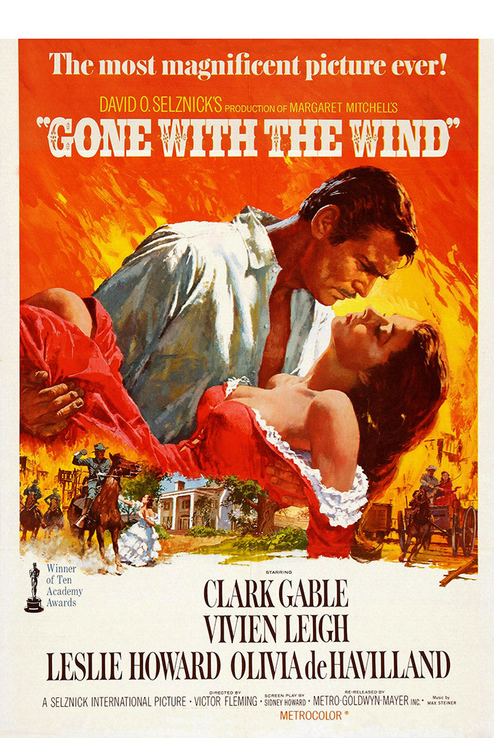 Gone with the Wind poster print featuring a man holding a woman in a red dress against fiery orange scenes of riders and a plantation.
