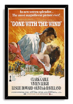 Gone with the Wind framed wall art print in a black frame, featuring the romantic couple over an orange battle and plantation scene.