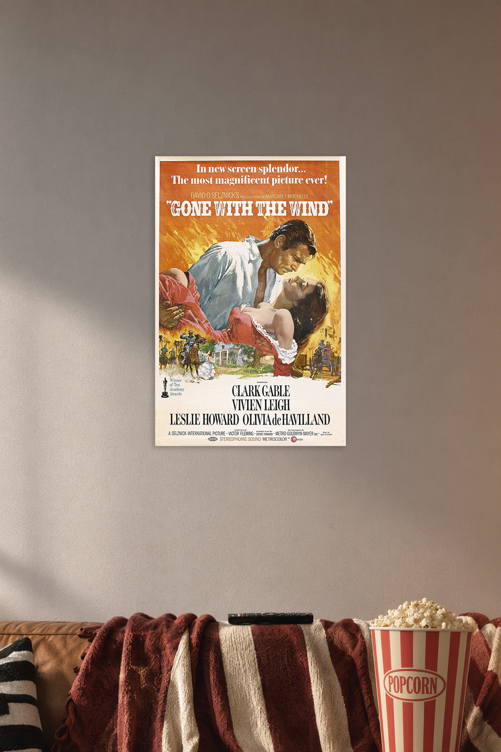 Gone with the Wind Movie in a cozy movie room above a brown sofa with popcorn.