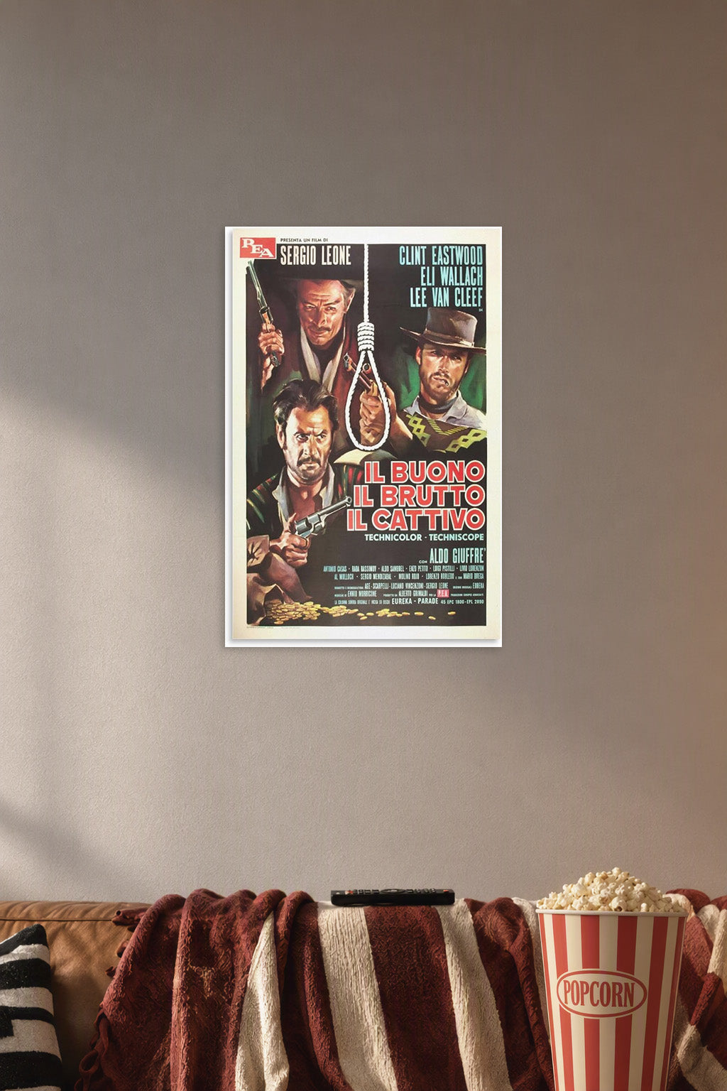 Good The Bad And The Ugly Movie Vintage Poster for Bedroom in a cozy movie room above a brown sofa with popcorn.