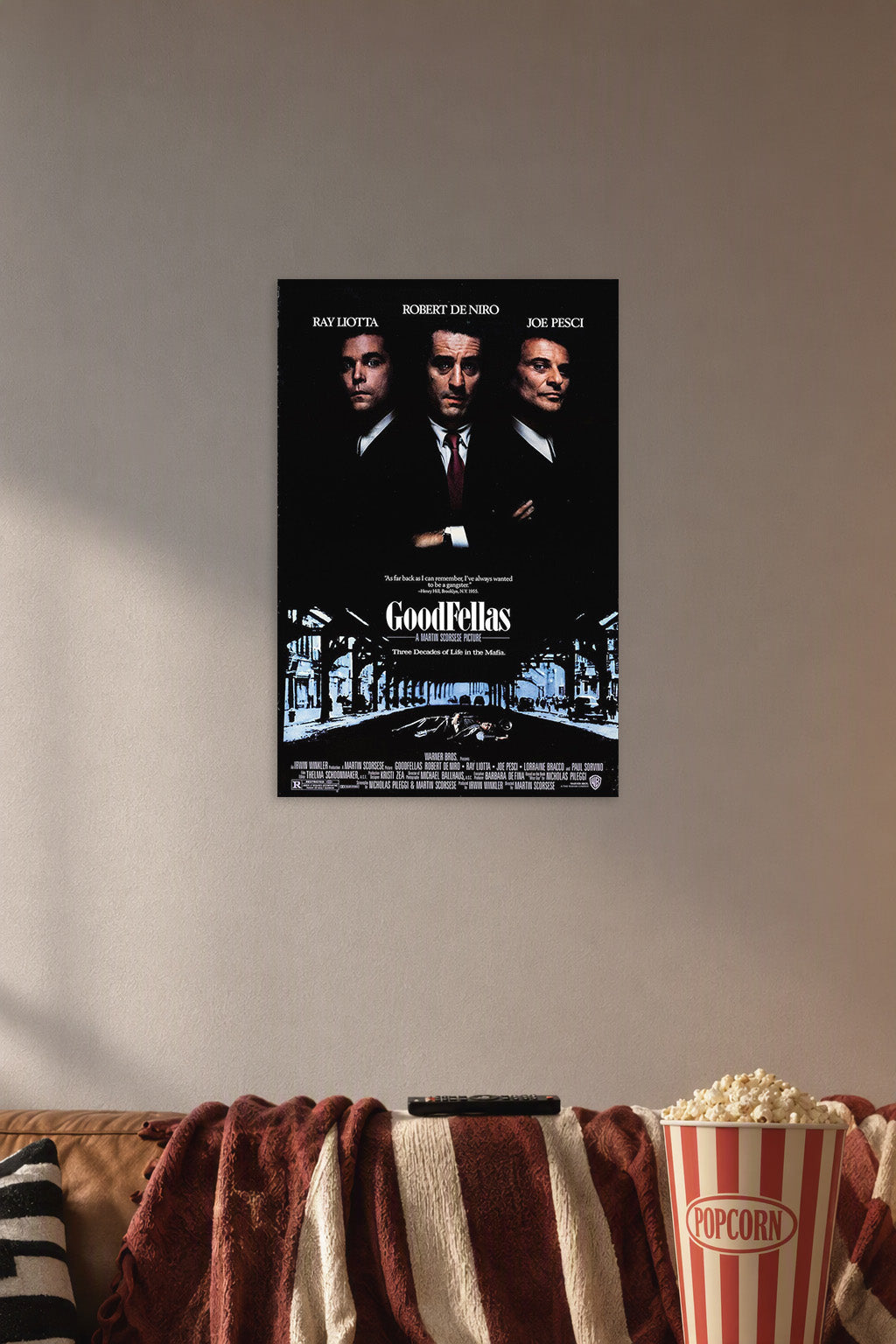GoodFellas Movie in a cozy movie room above a brown sofa with popcorn.