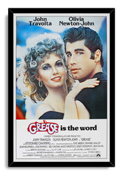 Grease movie poster wall art print in a black frame, featuring Olivia Newton-John and John Travolta embracing above film credits.