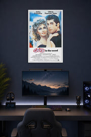 Grease Movie John Travolta Olivia Newton-John in a gaming desk setup above a monitor.