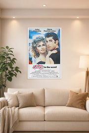 Grease Movie John Travolta Olivia Newton-John in a bright living room above a beige sofa.