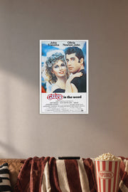 Grease Movie John Travolta Olivia Newton-John in a cozy movie room above a brown sofa with popcorn.