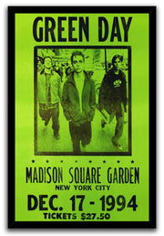 Green Day framed wall art print features three men walking beneath bold black text on a neon green concert design.