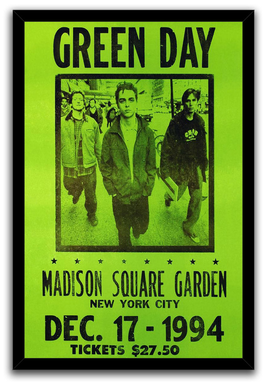 Green Day framed wall art print features three men walking beneath bold black text on a neon green concert design.