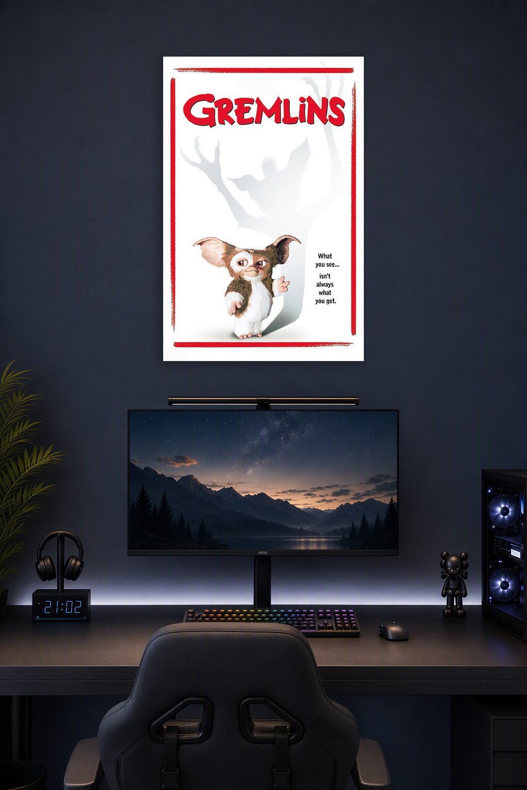 Gremlins in a gaming desk setup above a monitor.