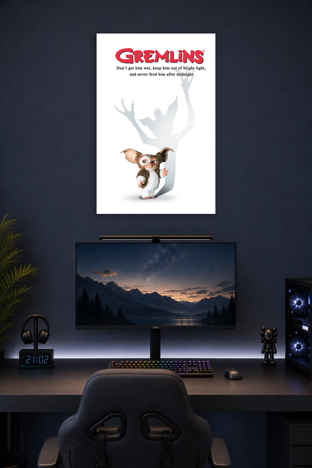 Gremlins in a gaming desk setup above a monitor.