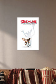 Gremlins in a cozy movie room above a brown sofa with popcorn.