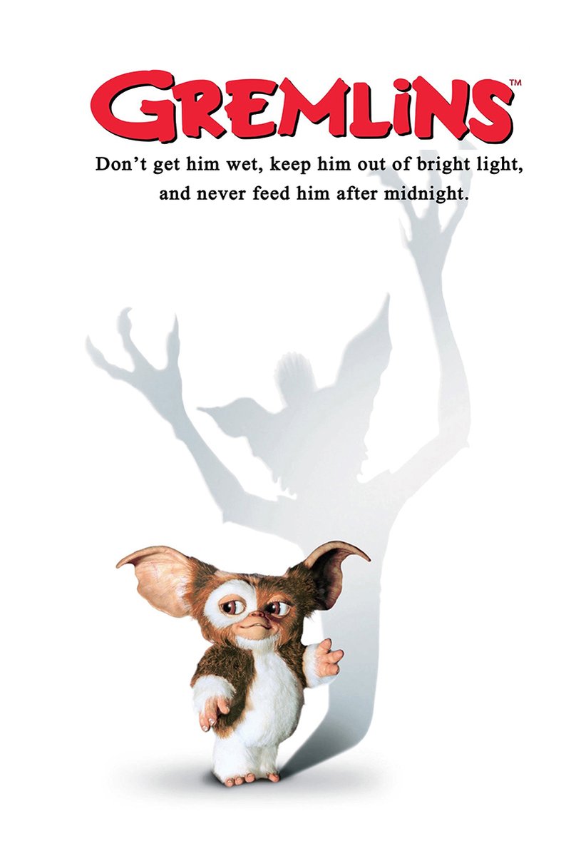 Gremlins poster featuring Gizmo beneath a looming gray monster shadow, red title lettering, and three cautionary rules on white.