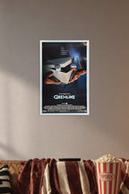 Gremlins Movie Poster in a cozy movie room above a brown sofa with popcorn.