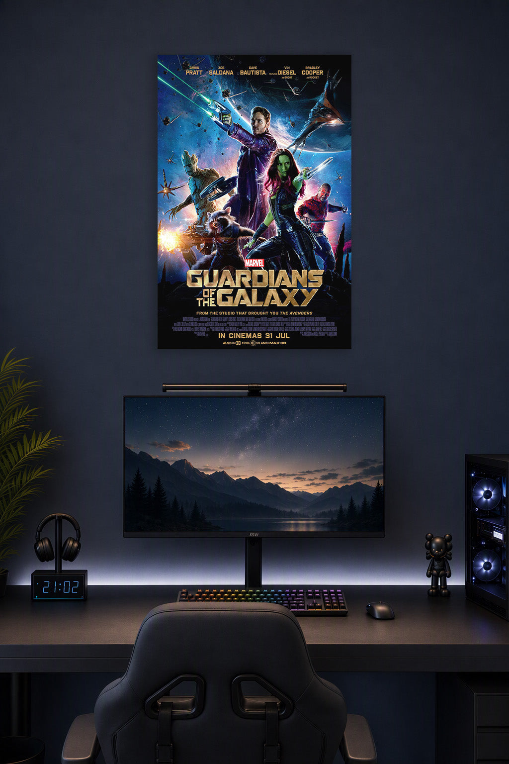 Guardians of the Galaxy in a gaming desk setup above a monitor.
