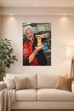 Guy Fieri in a bright living room above a beige sofa.