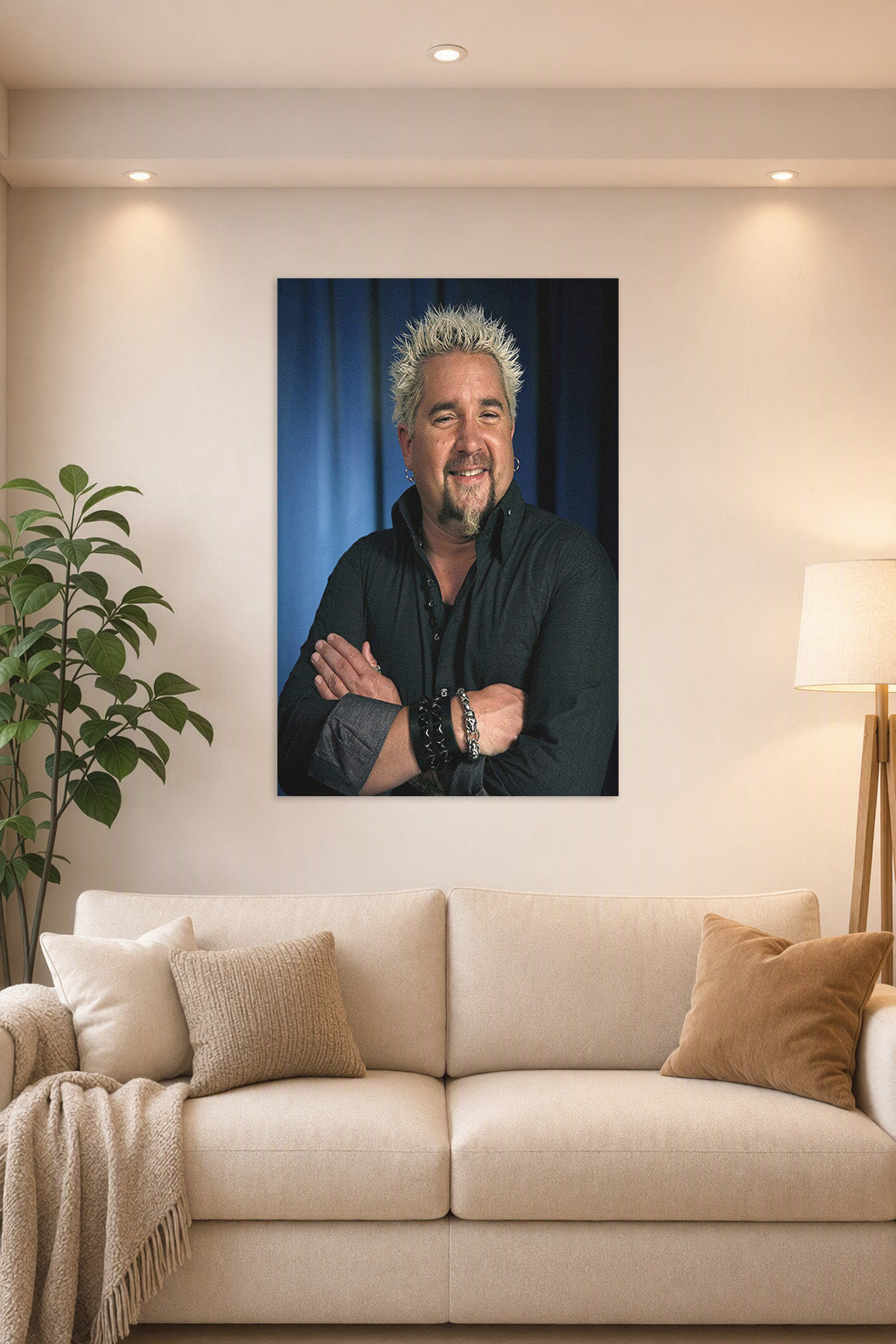 Guy Fieri in a bright living room above a beige sofa.