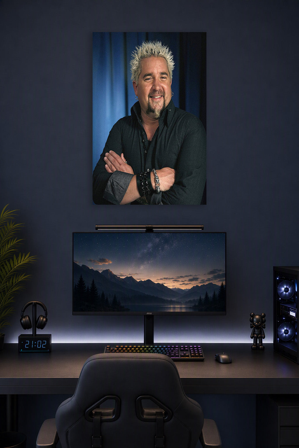 Guy Fieri in a gaming desk setup above a monitor.