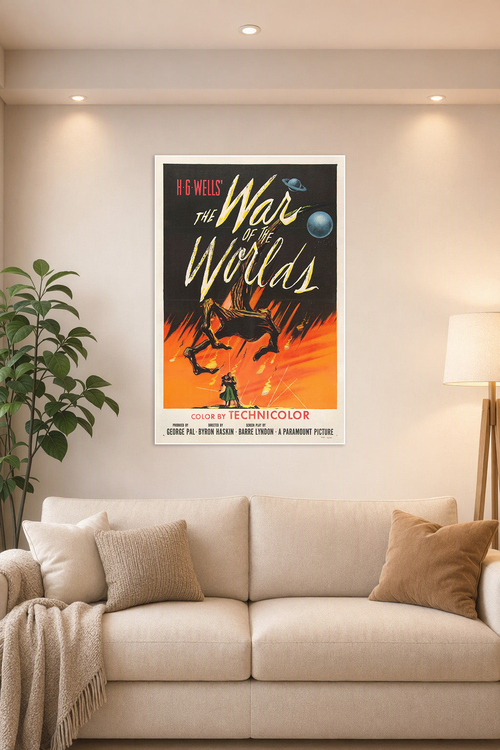 H.G. Wells' The War of the Worlds Movie Poster in a bright living room above a beige sofa.