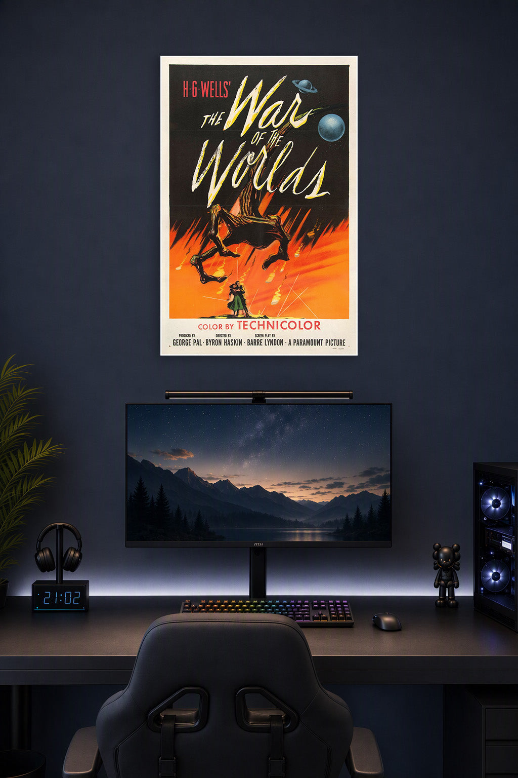 H.G. Wells' The War of the Worlds Movie Poster in a gaming desk setup above a monitor.