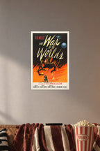 H.G. Wells' The War of the Worlds Movie Poster in a cozy movie room above a brown sofa with popcorn.