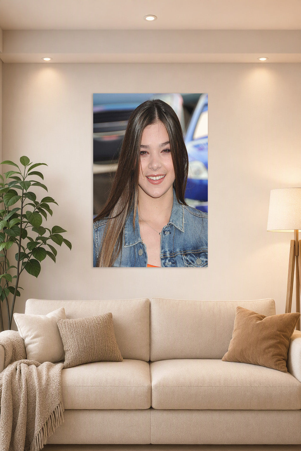 Hailee Steinfeld in a bright living room above a beige sofa.