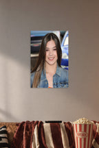 Hailee Steinfeld in a cozy movie room above a brown sofa with popcorn.