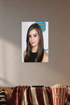Hailee Steinfeld in a cozy movie room above a brown sofa with popcorn.
