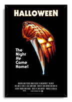 Halloween framed wall art print in a black mitered frame, with a hand-held knife and illuminated orange jack-o'-lantern.