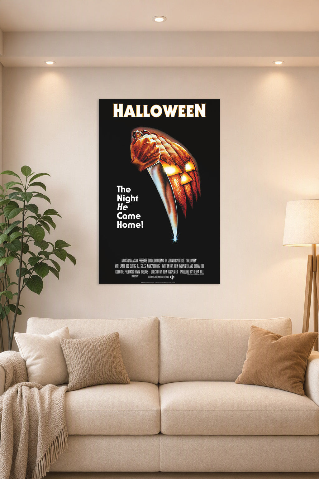 Halloween Movie Poster in a bright living room above a beige sofa.