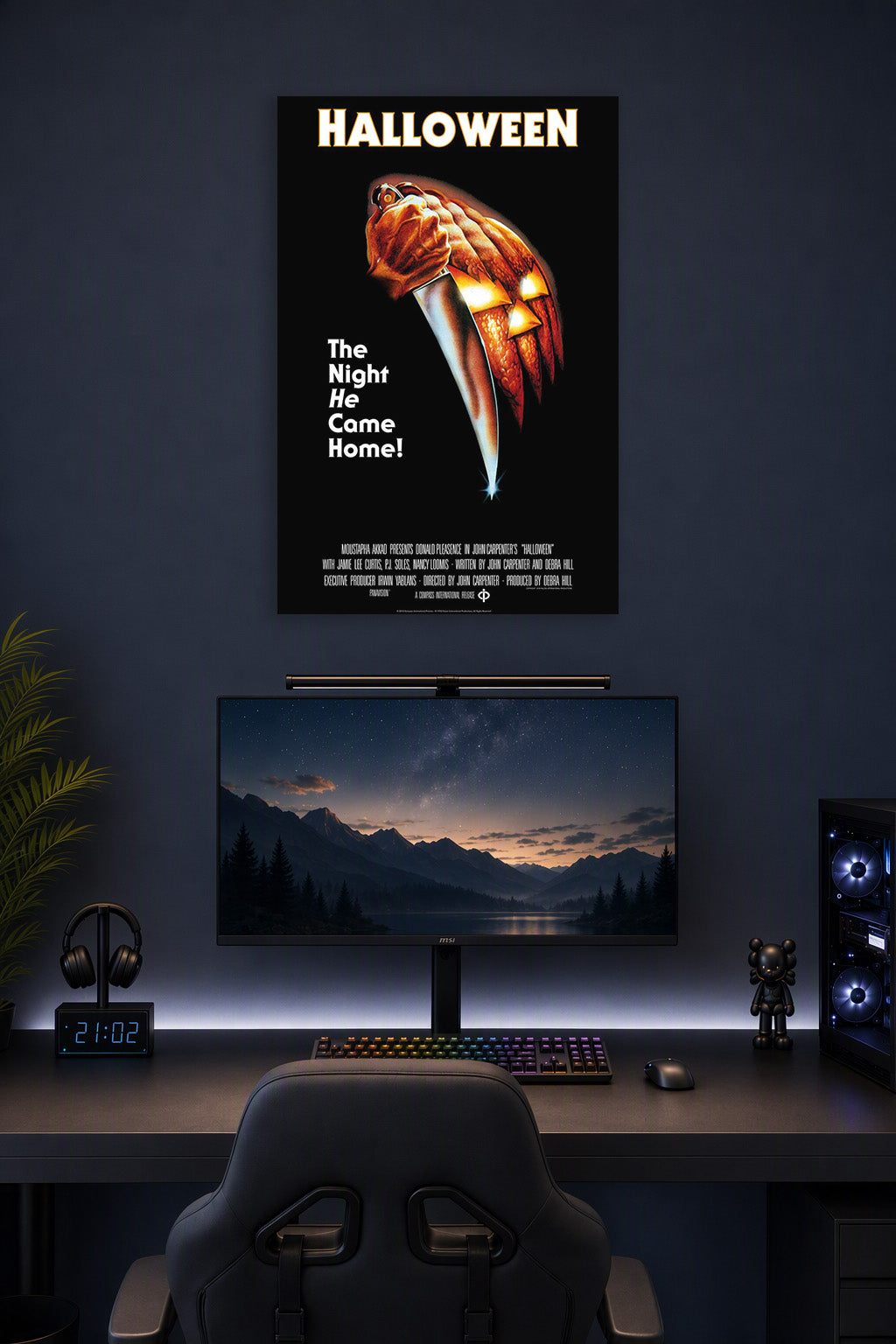 Halloween Movie Poster in a gaming desk setup above a monitor.