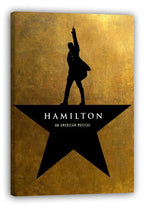 Hamilton wall art canvas displays the black star, raised-arm silhouette, and white musical title on textured gold.