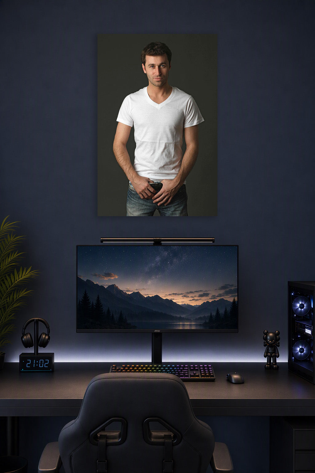 Handsome Man in a gaming desk setup above a monitor.
