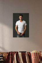 Handsome Man in a cozy movie room above a brown sofa with popcorn.